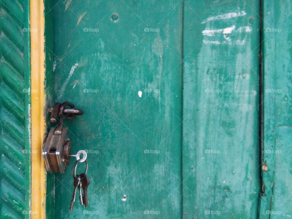 Close-up of a padlock hanging on door
