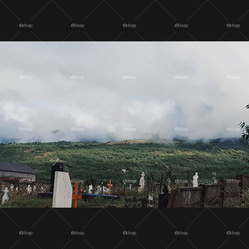 Graveyard and cloudy sky