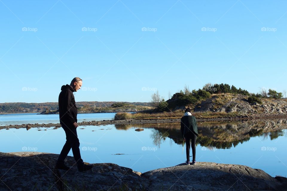 People standing near the lake