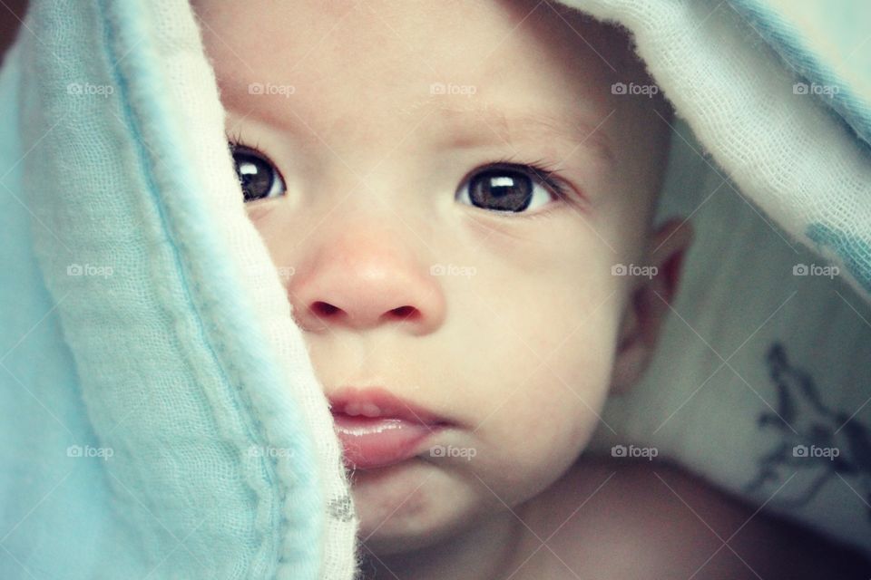 Close-up of baby with towel