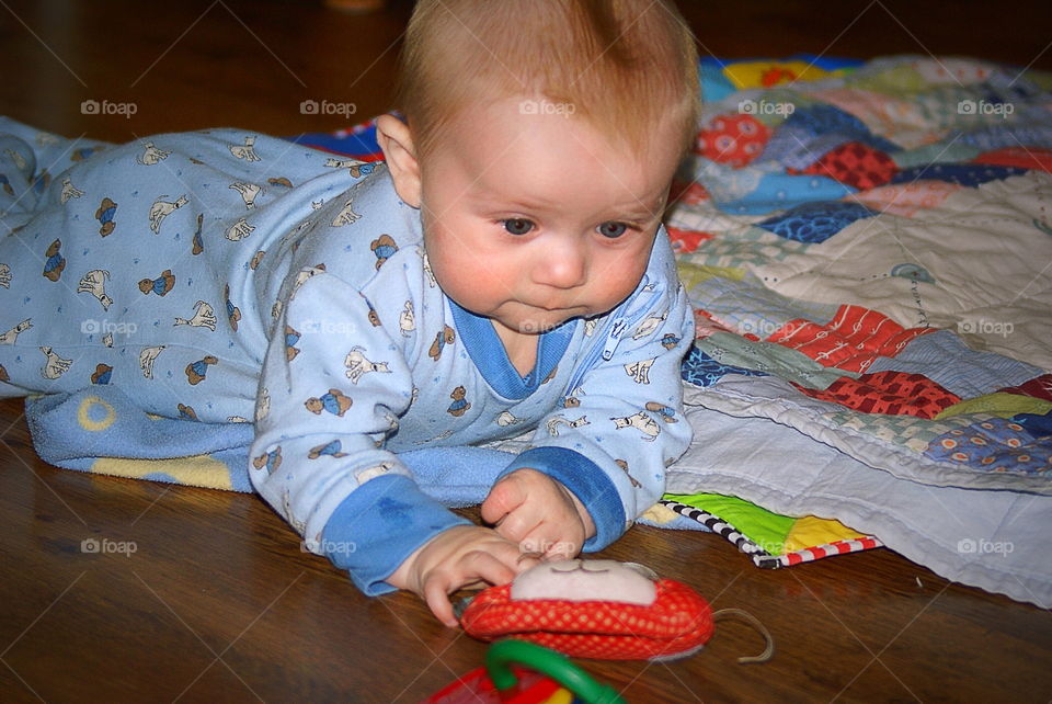 Cute kid playing with toy