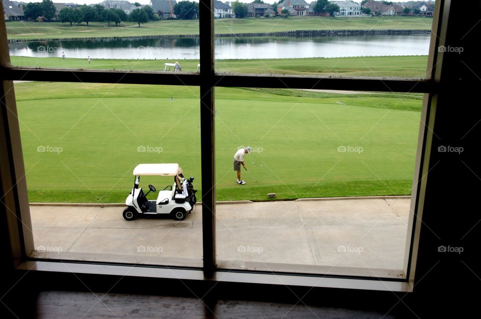 Golfer practicing putting