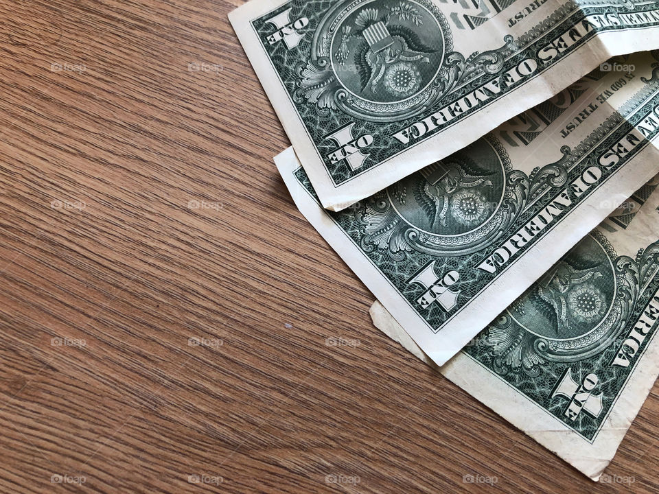 dollars on wooden background
