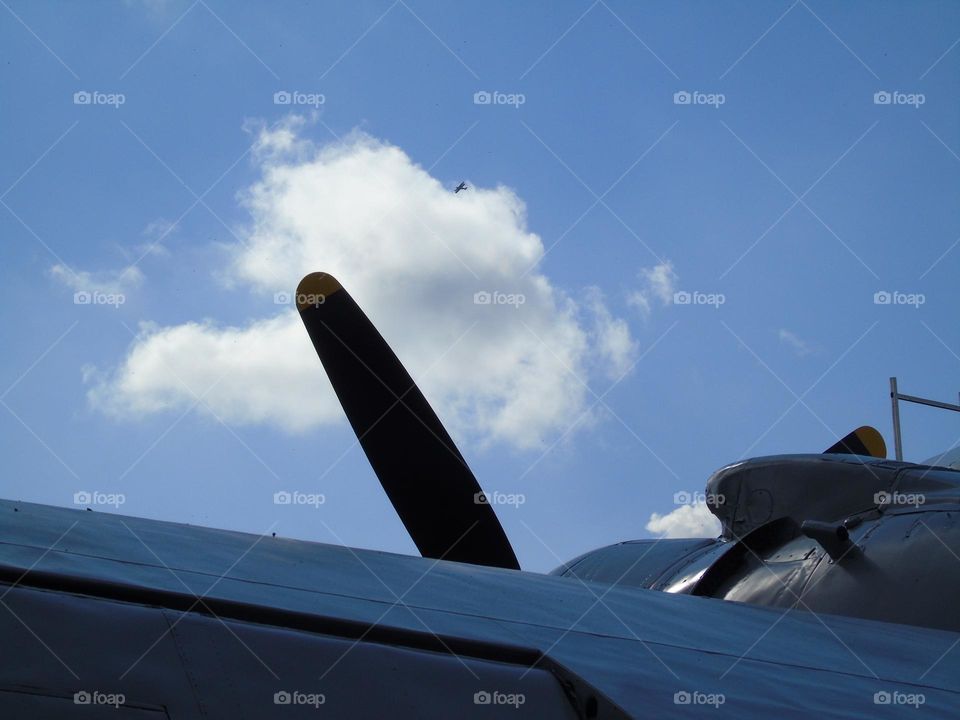 Beautiful vintage airplane with byplane flying above, UK