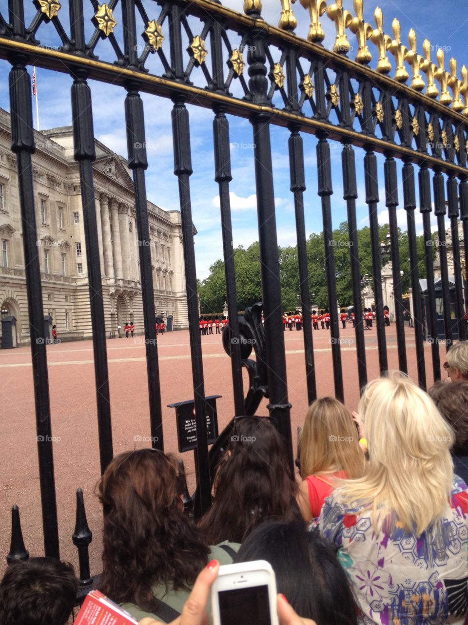 People watching the guards and waiting for the royals