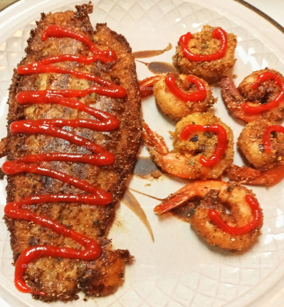 homemade Swai fish, jumbo shrimp topped with sriracha sauce