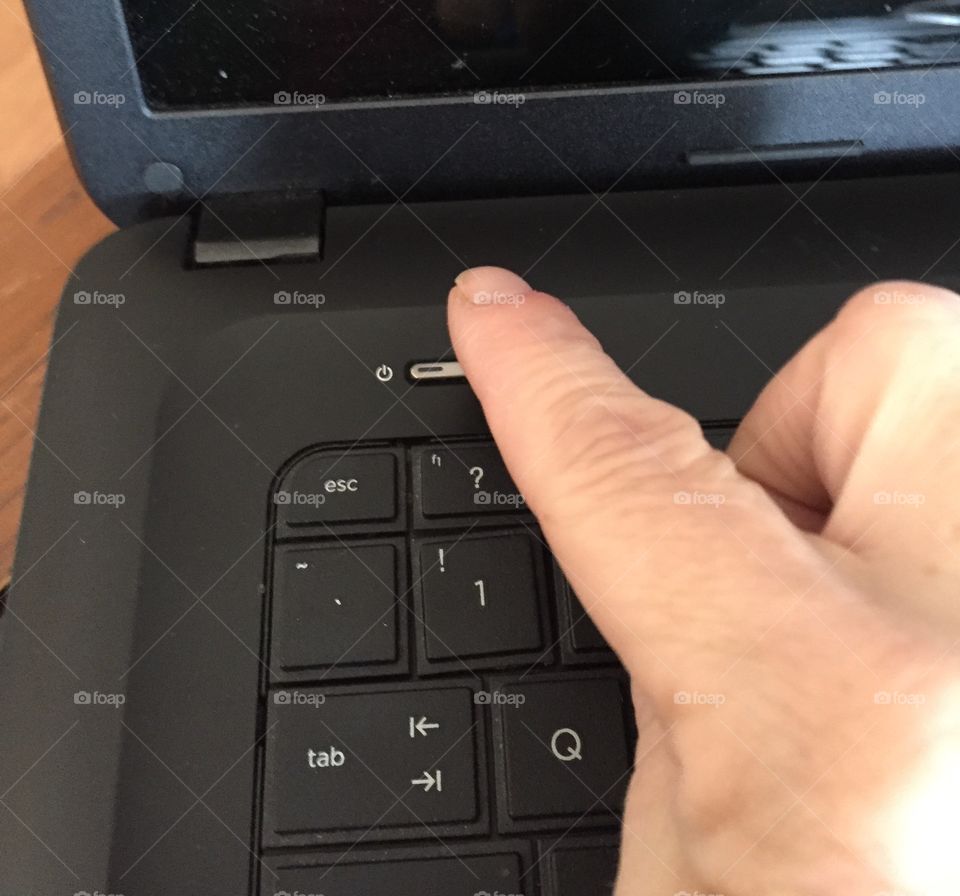 Morning ritual of turning on the laptop computer