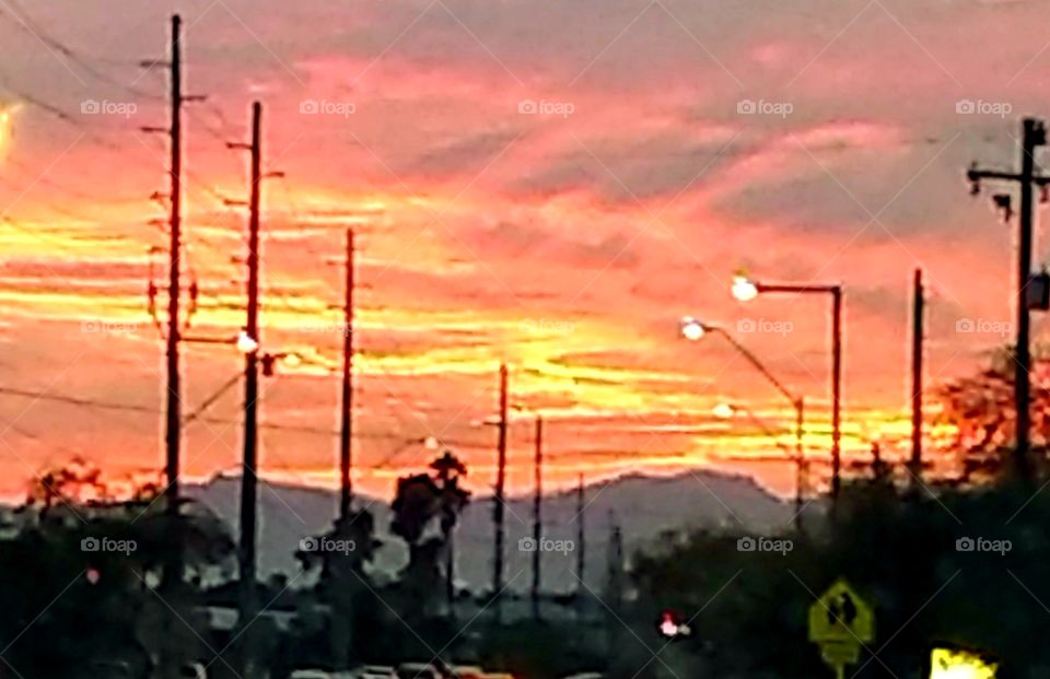 Phoenix,  AZ. fiery sunset viewed from Mtn. Preserve  trail.