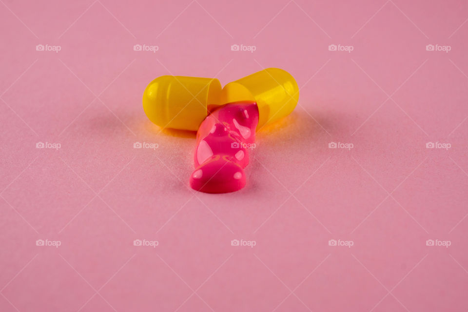 Pill with pink liquid from it