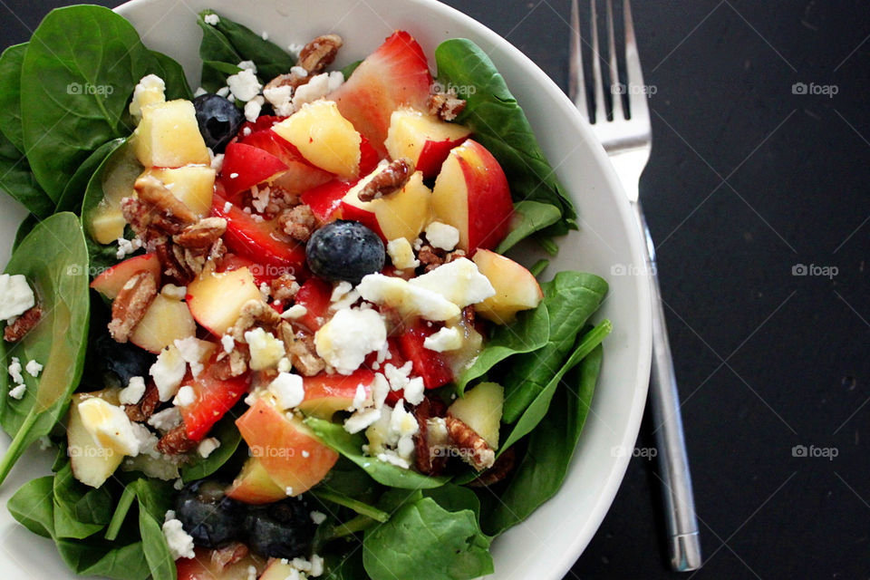 Salad against black background