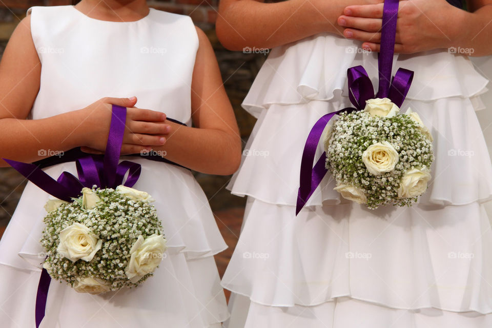 Flower girlsposibg with petite bouquets