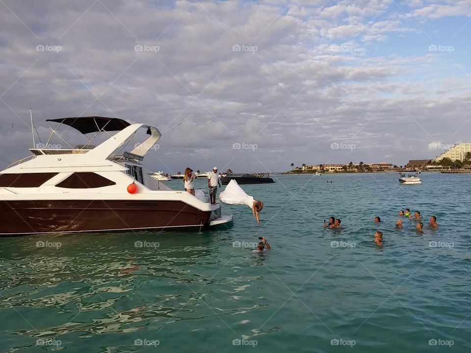 bride jumping in water