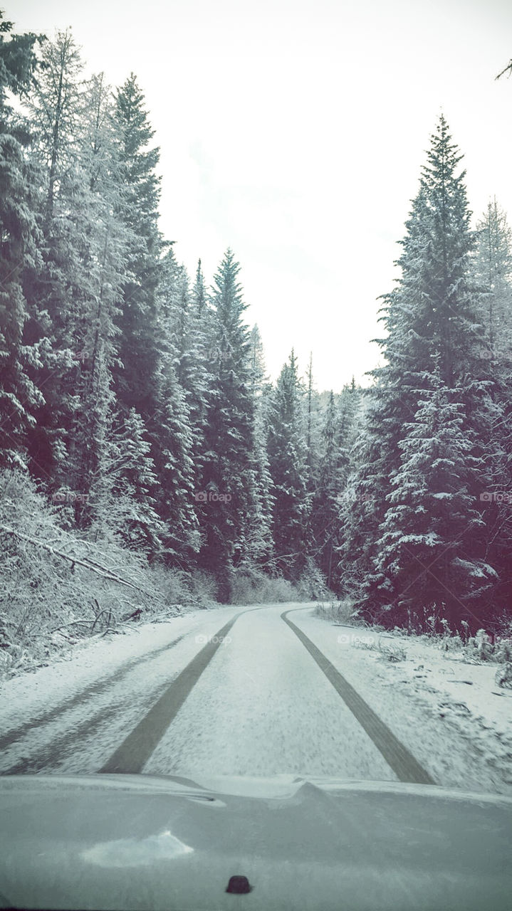 Driving on a snowy mountain path. 