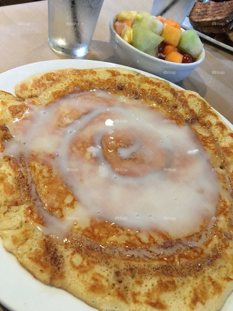 Cinnamon roll pancakes and fresh fruit