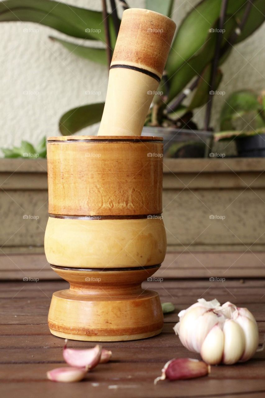 wooden garlic crusher