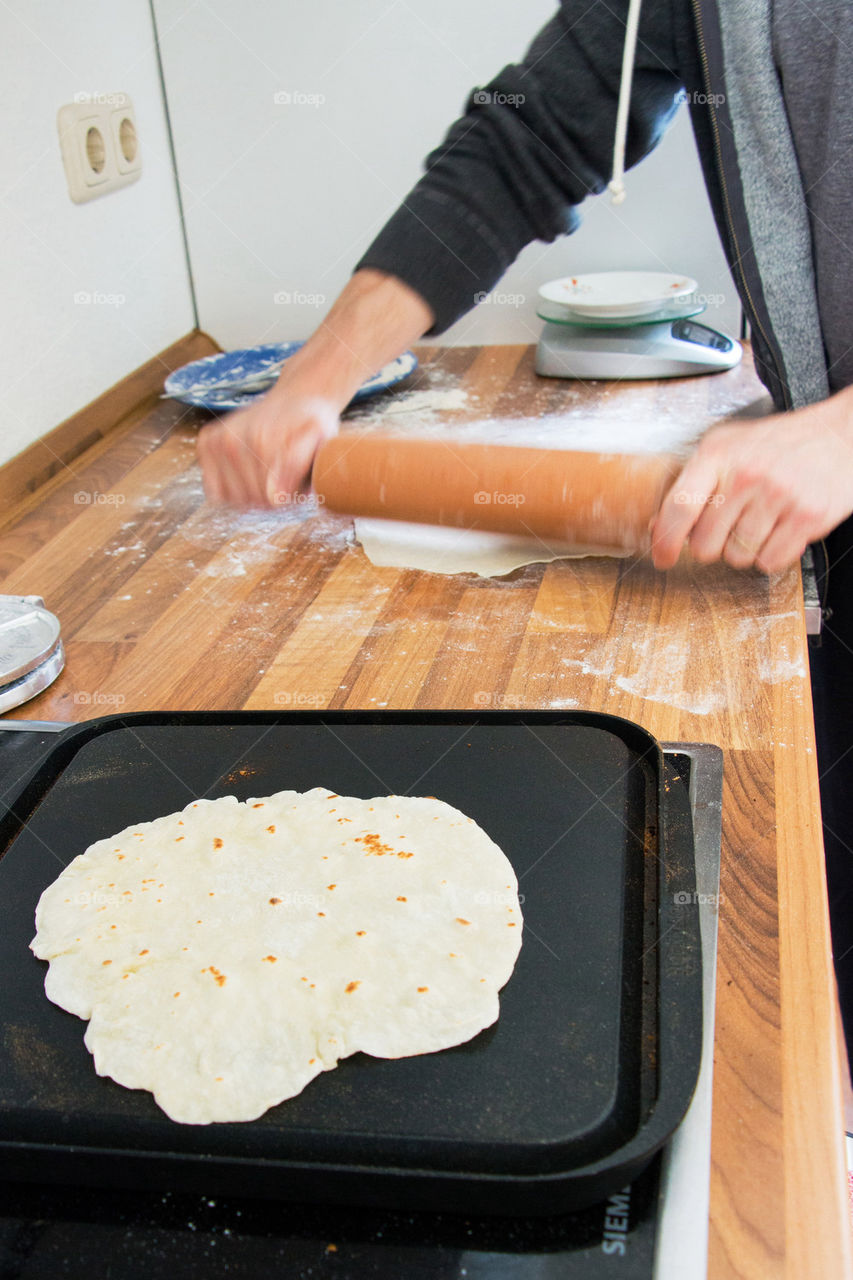 Baking and rolling tortillas 