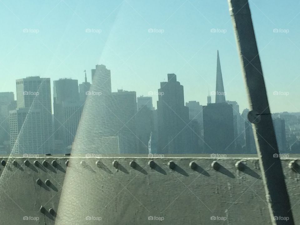 View of city skyscrapers through glass window