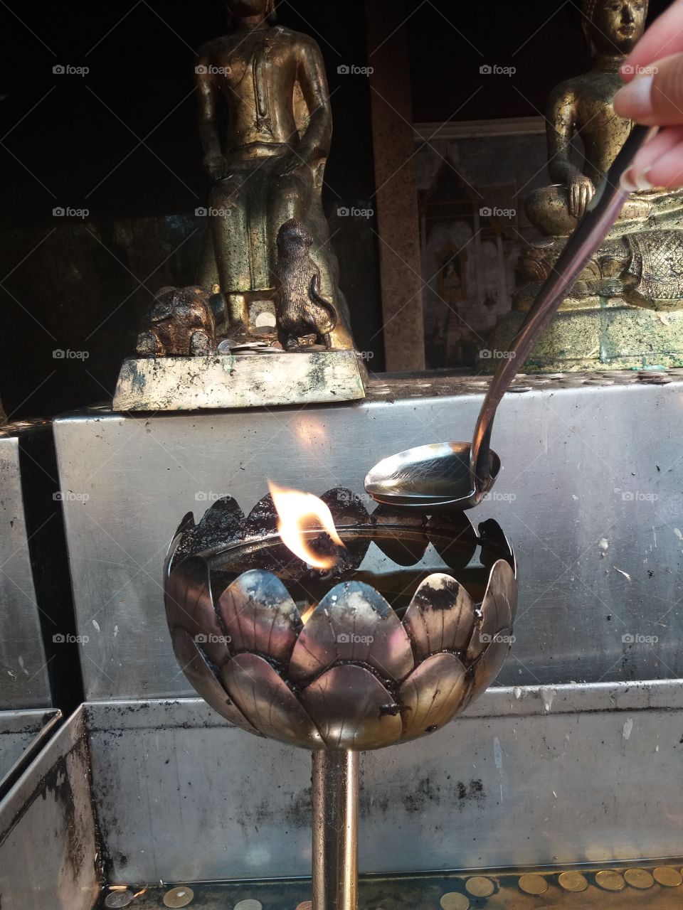 metallic lamp with fire in oil