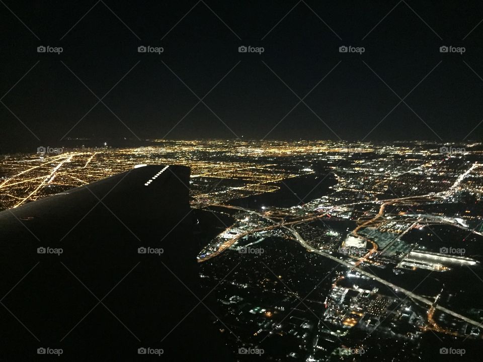 Flying over the city at night 
