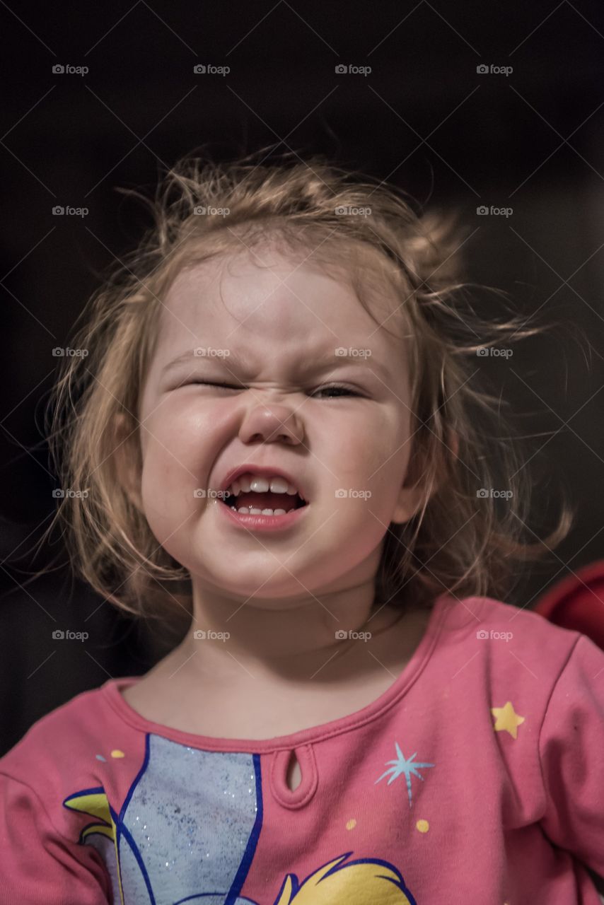 Close-up of a girl winking