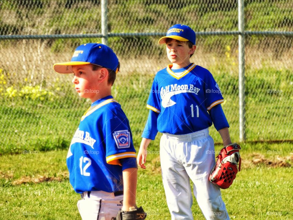 Young Ball Players In The Outfield
