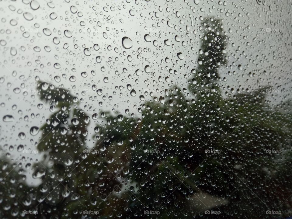 Photography of rain drops. Macro photography of droplets on glass