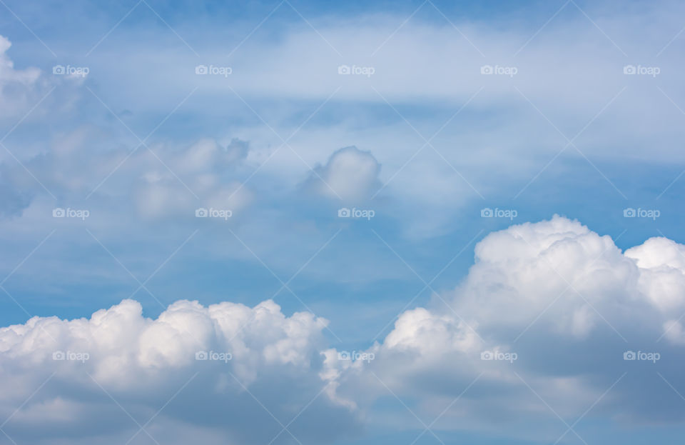 The beauty of the sky with clouds and the sun.