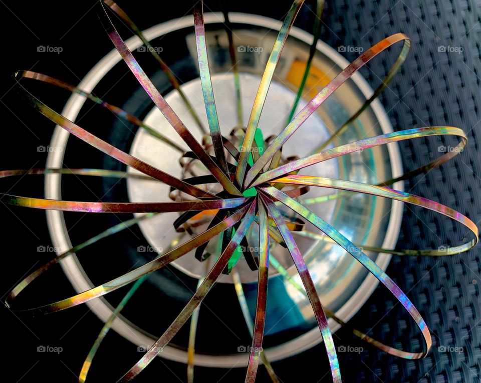 Rainbow Colors Metal Circles Sitting On Metal Bowl