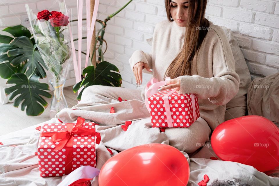 woman holding christmas gifts