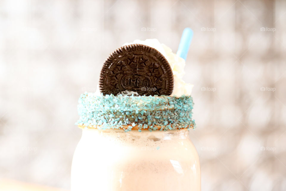 Oreo Milkshake close up. Cookies and cream flavor.