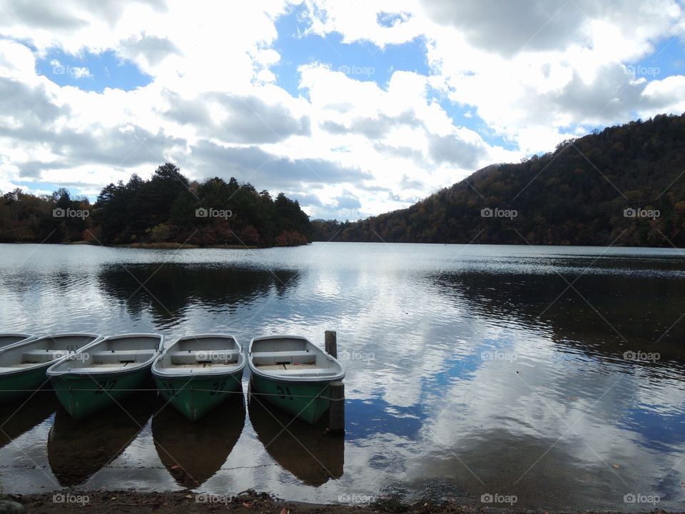 Boats reflecting on lake