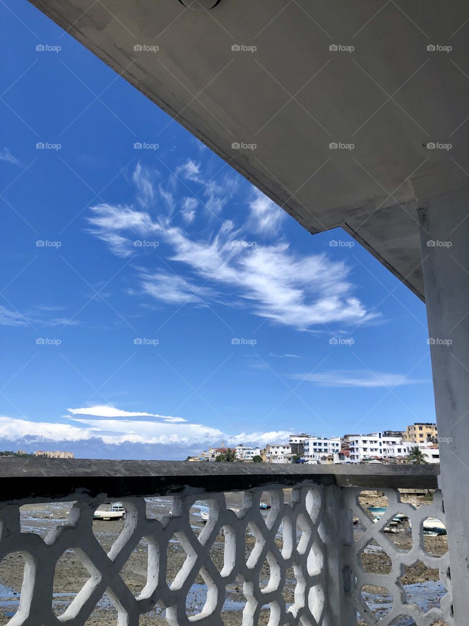 Mysterious clouds adorning azure blue sky 