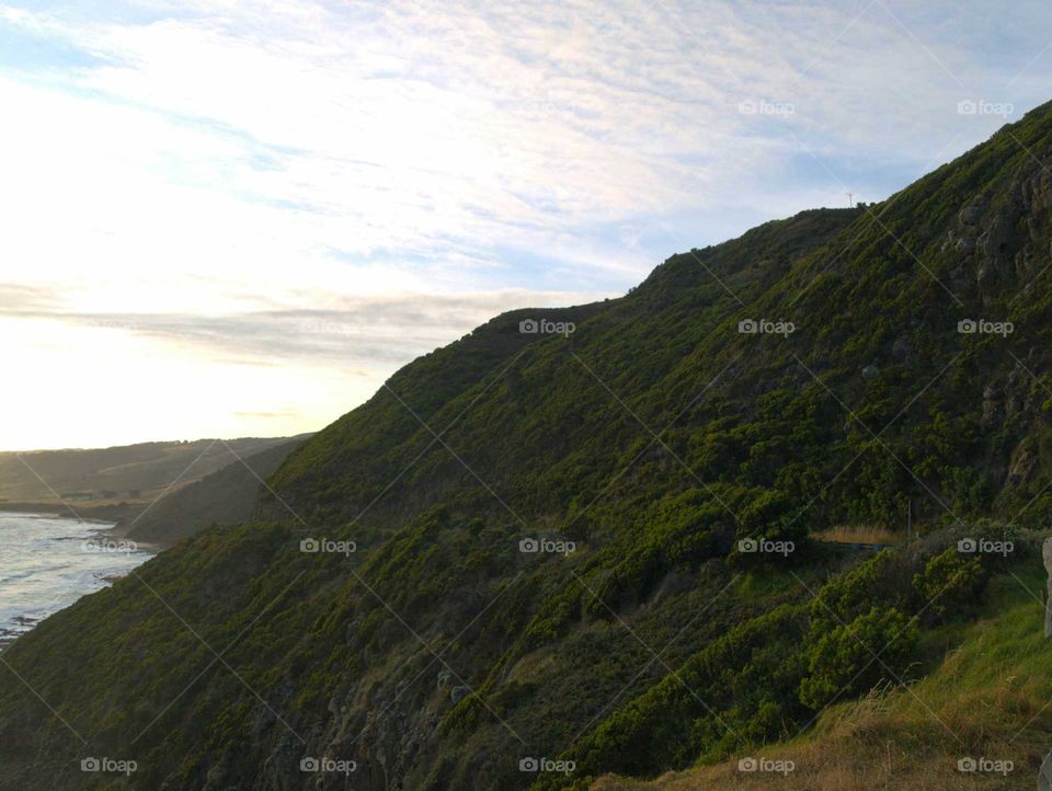 fog at morning over a street at the great ocean road, Australia