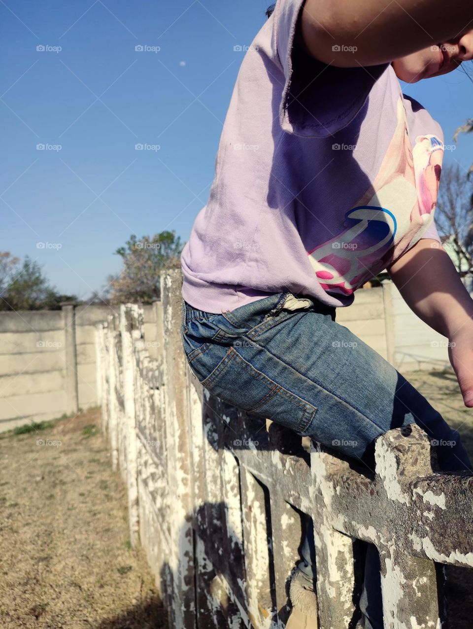 Sitting on concrete wall