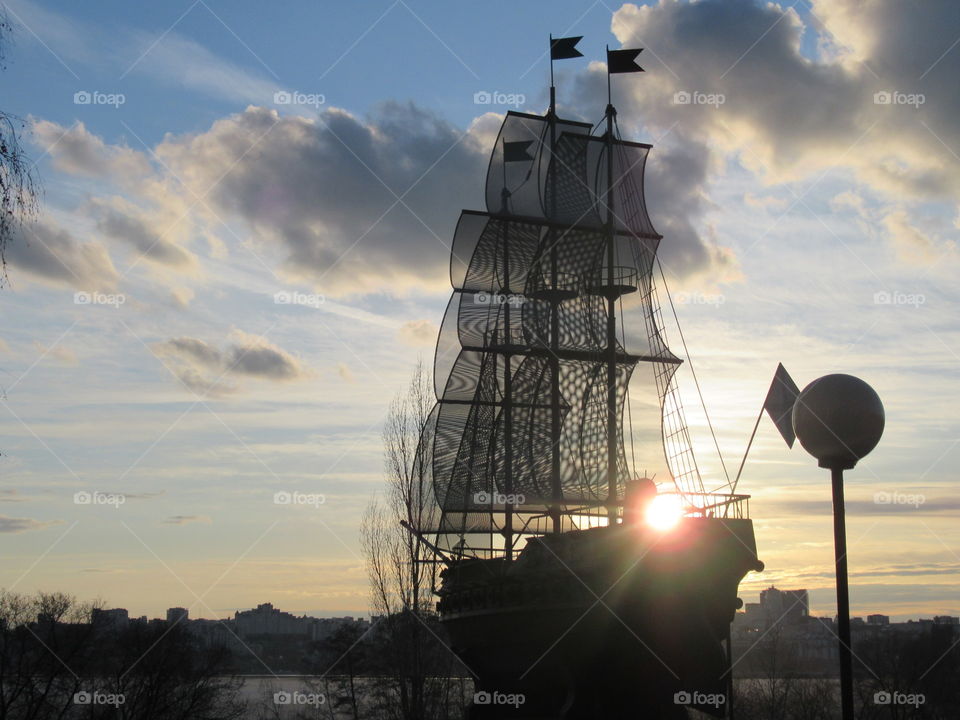 model frigate at sunset