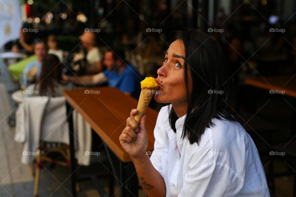 girl eats ice cream and is surprised, it is very tasty