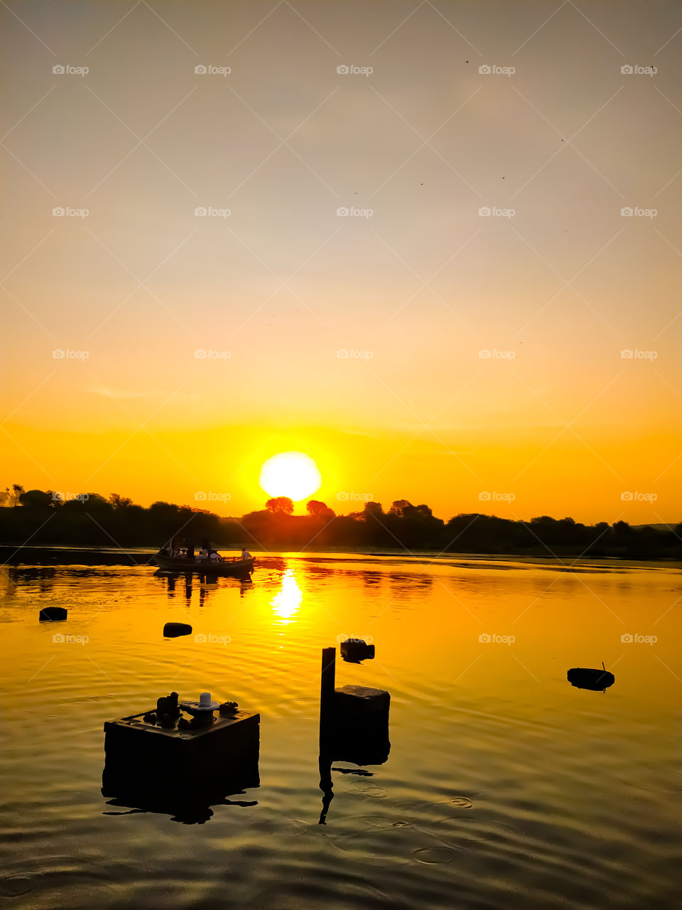 In the morning time people roam in the river by boat along with the small idol of Lord Shiva inside the river water