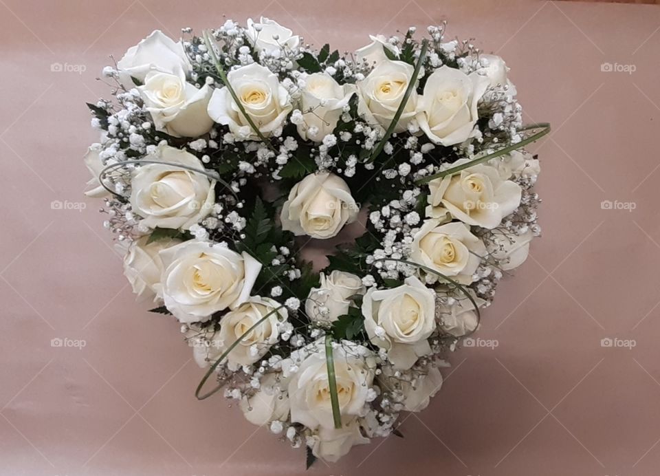 Cream Rose floral tribute in a heart shape  floral arrangement