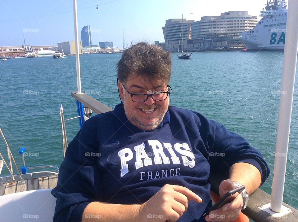 Happy man strolling a boat