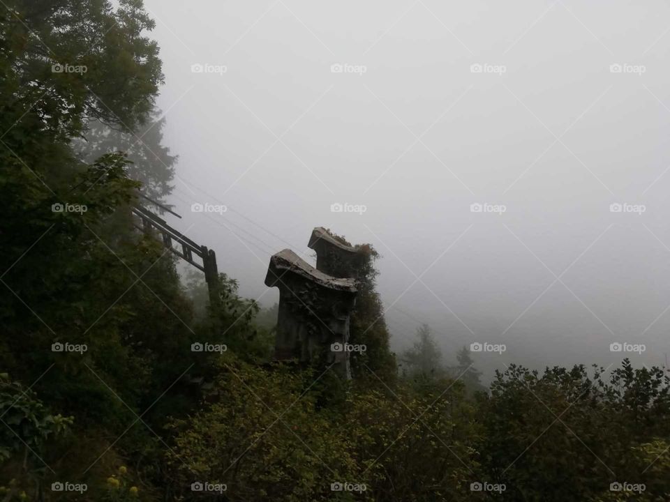 fog around a dismissed cable car, Campo dei fiori, Varese, Italy