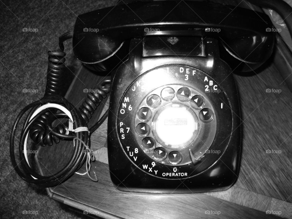 Old rotary phone black. Old rotary phone black