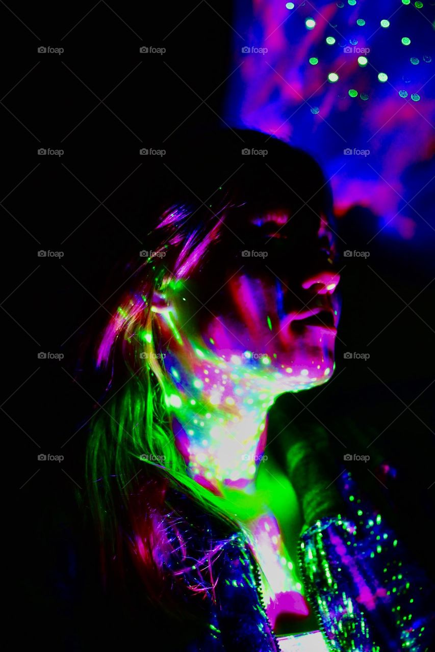 Girl lighted with galaxy-lamp