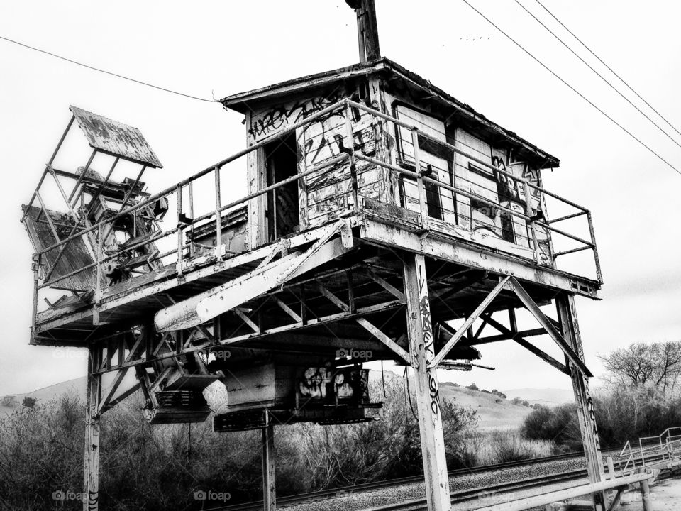 Black And White Architecture. Railroad Support Building Covered In Graffiti
