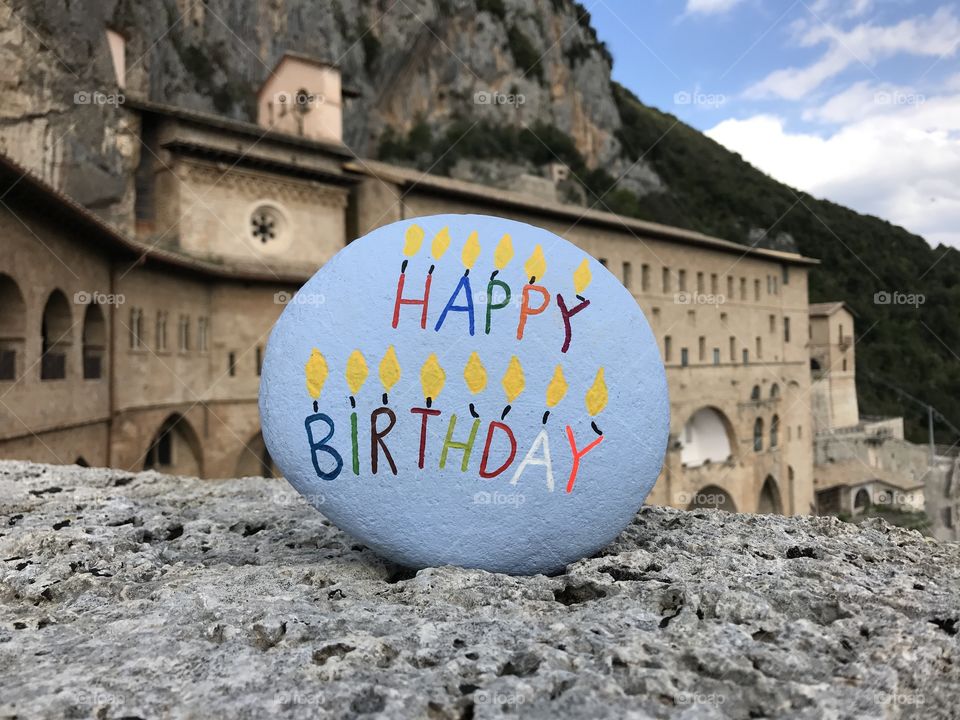 Happy Birthday stone with historic background, an old abbey in Italy 