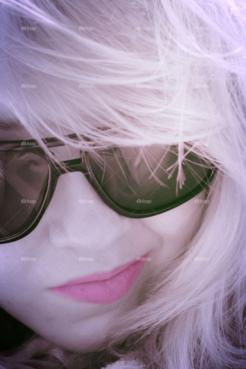 Close-up of woman's face with sunglasses