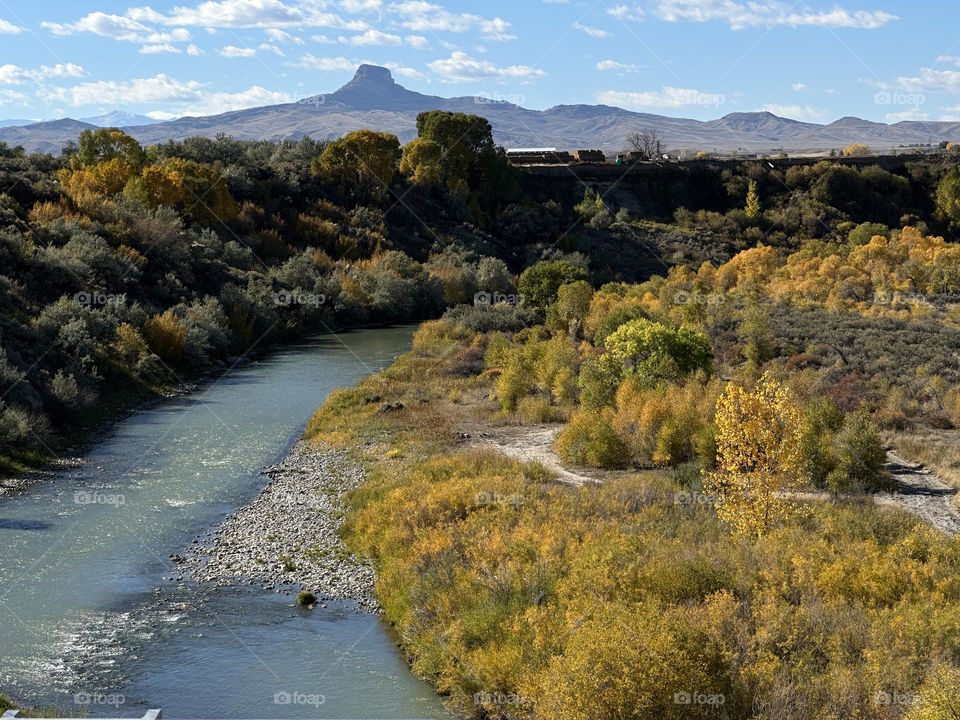 Hart Mountain overlooking autumn hues on the Shoshone river on a bright, sunny day.
