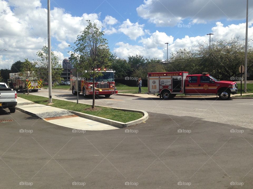 Three fire trucks arrive at the scene