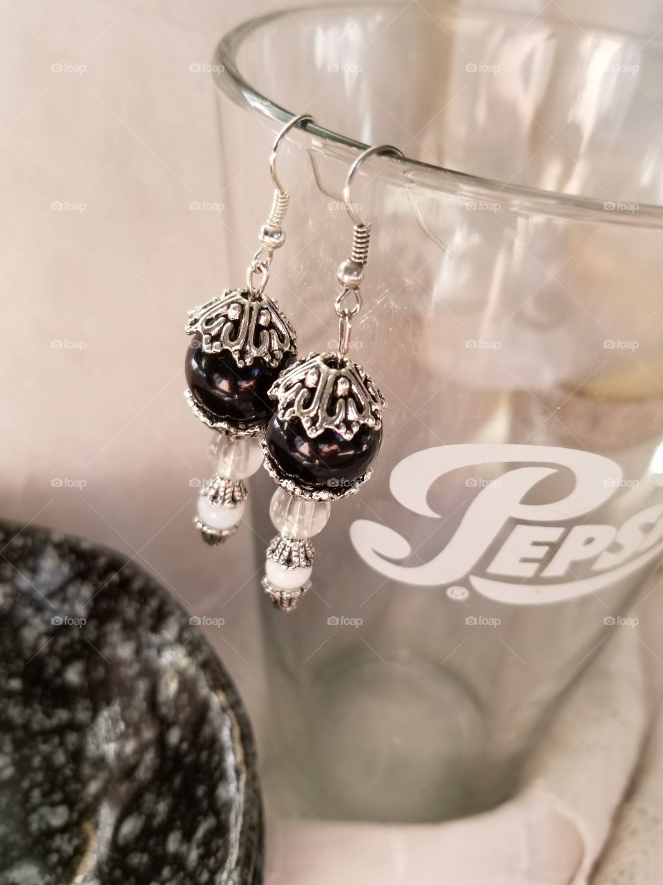 My handmade earrings (found on my etsy) hanging from a vintage Pepsi Cola glass.