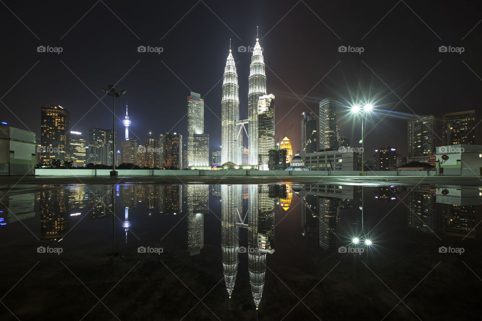 View of Kuala Lumper skyline at night with reflections