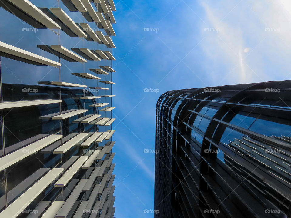 2 city buildings reflecting off each other. 🏙